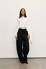 Sorella Poncho Ivory by Bayse – soft draped poncho with mock neckline and fluid layered silhouette.