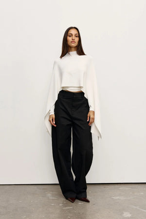 Sorella Poncho Ivory by Bayse – soft draped poncho with mock neckline and fluid layered silhouette.