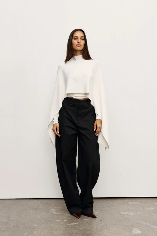 Sorella Poncho Ivory by Bayse – soft draped poncho with mock neckline and fluid layered silhouette.