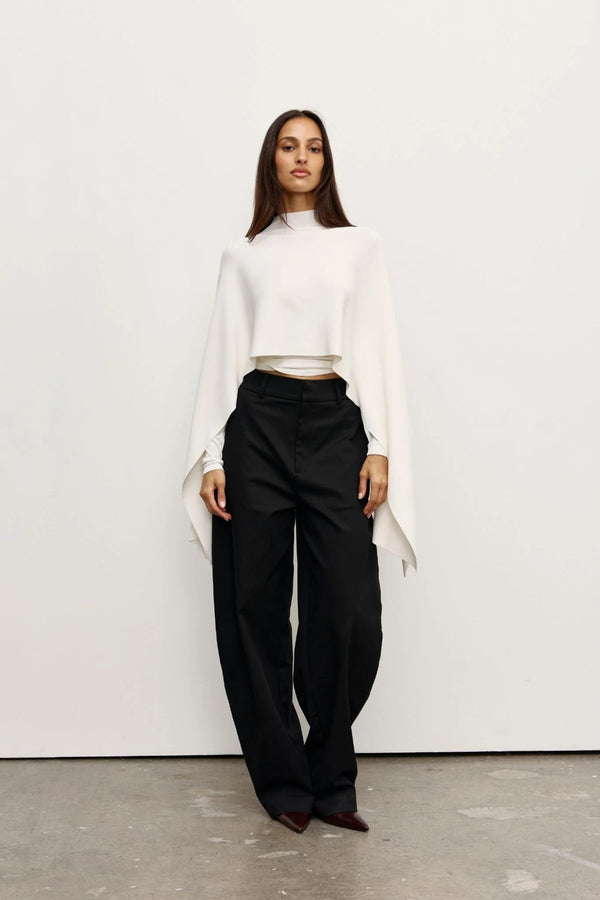 Sorella Poncho Ivory by Bayse – soft draped poncho with mock neckline and fluid layered silhouette.