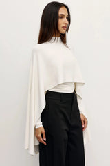 Sorella Poncho Ivory by Bayse – soft draped poncho with mock neckline and fluid layered silhouette.