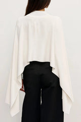 Sorella Poncho Ivory by Bayse – soft draped poncho with mock neckline and fluid layered silhouette.