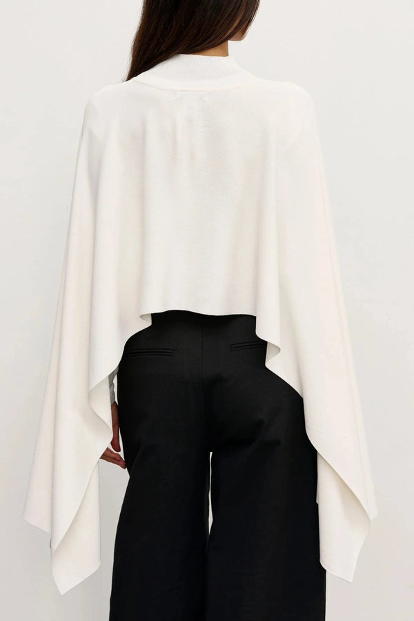 Sorella Poncho Ivory by Bayse – soft draped poncho with mock neckline and fluid layered silhouette.