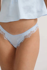 Kat the Label Sorrento Thong in Ice, soft satin with delicate eyelash lace, high-cut fit with sheer mesh back, elegant and comfortable for everyday wear.
