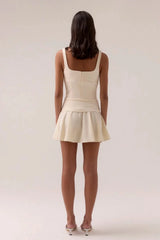 Sovere Demi Mini Dress in Lemonade, a sleeveless mini with scooped neckline, belted waist, and softly gathered skirt for chic summer style.