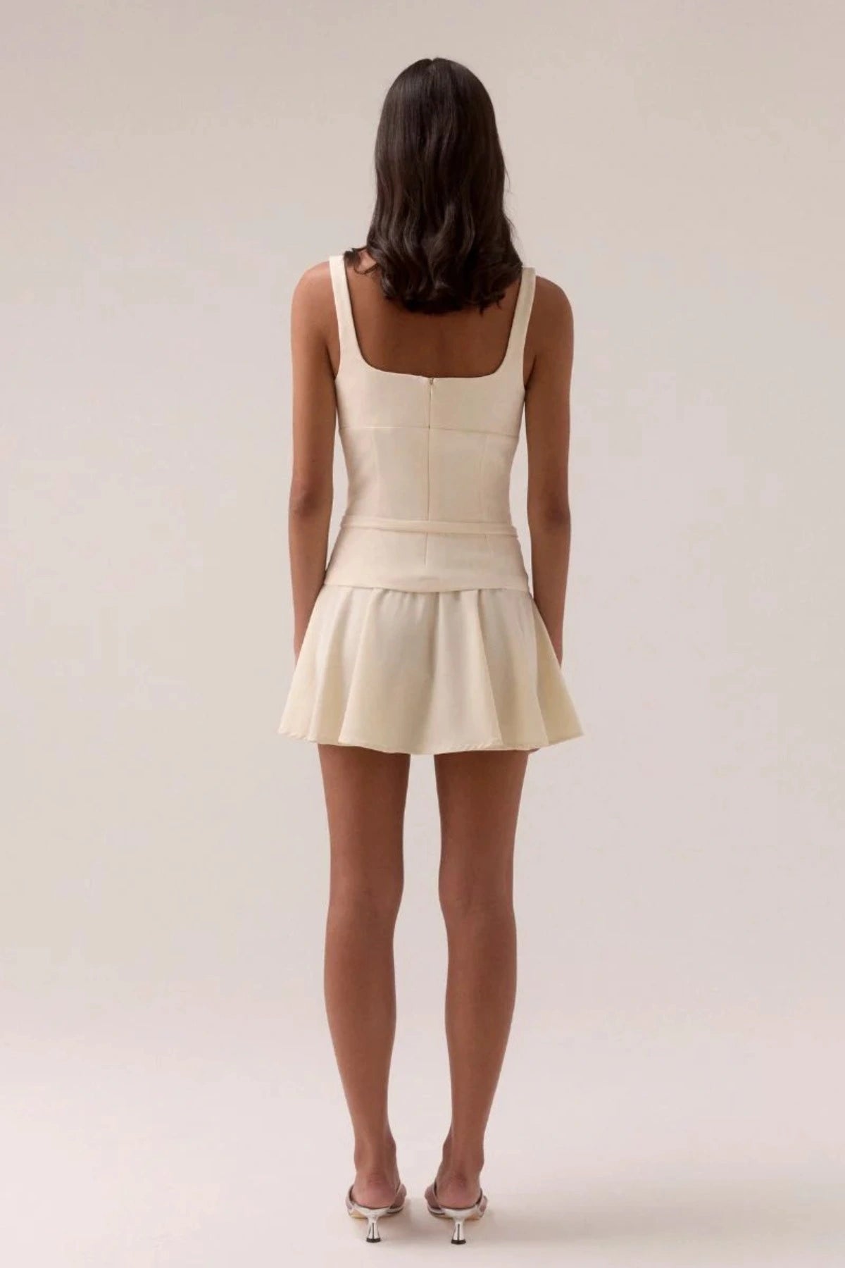 Sovere Demi Mini Dress in Lemonade, a sleeveless mini with scooped neckline, belted waist, and softly gathered skirt for chic summer style.