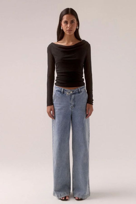 Sovere Myriad Cowl Long Sleeve in Black, a sleek fitted top with an off-shoulder cowl neckline, side gathers, and stretch mesh for a chic, modern look.