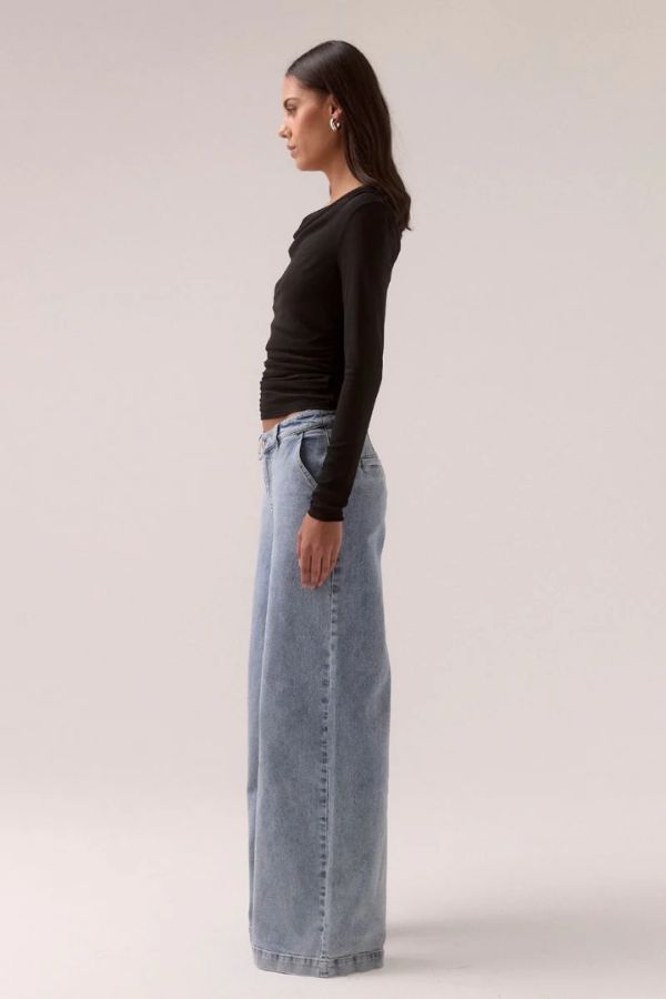 Sovere Myriad Cowl Long Sleeve in Black, a sleek fitted top with an off-shoulder cowl neckline, side gathers, and stretch mesh for a chic, modern look.