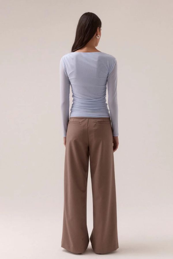 Sovere Myriad Cowl Long Sleeve in Cool Blue, a fitted mesh top with cowl neckline, asymmetric drop shoulder, and side gathers for a sleek, modern finish.