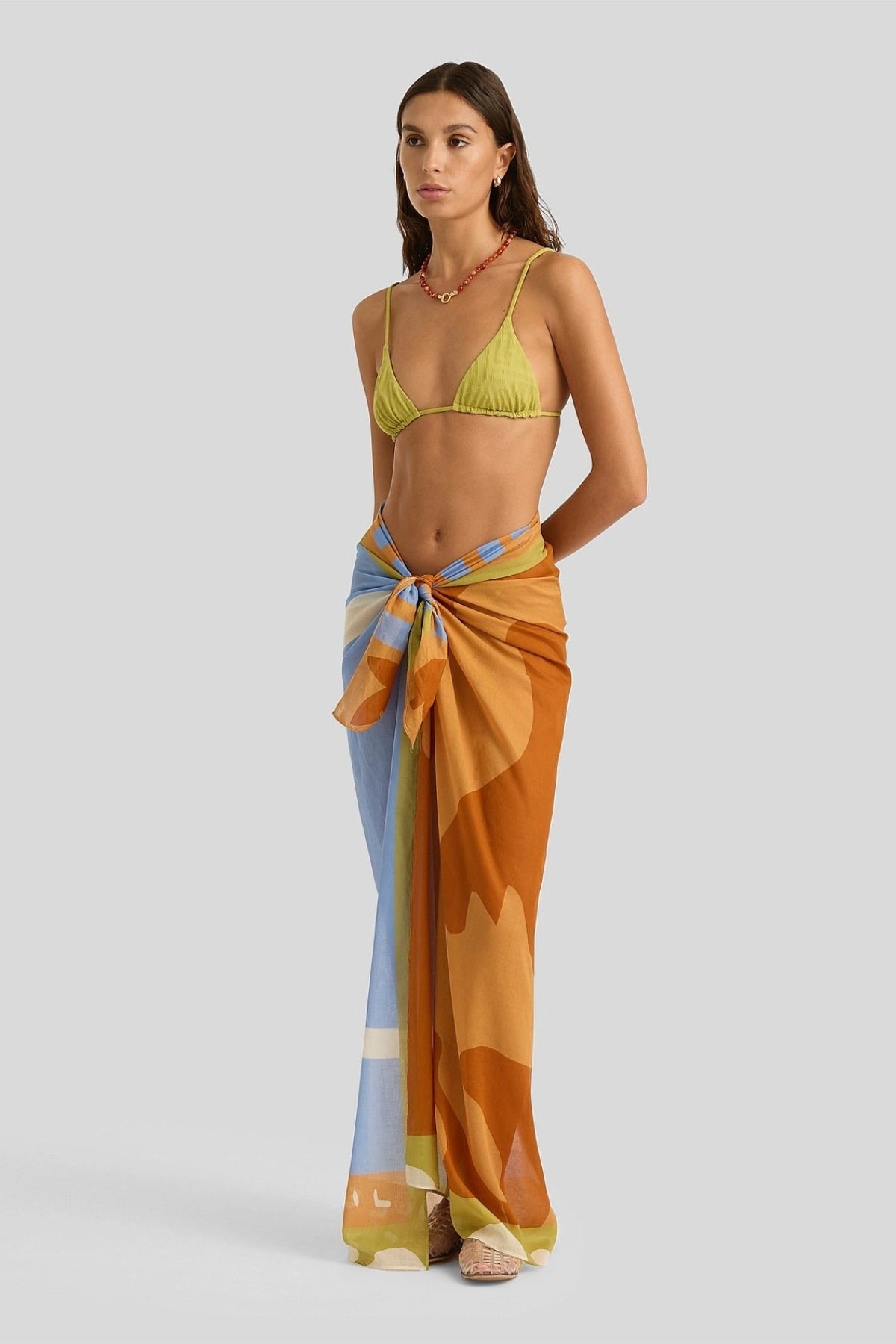 Square Pareo by Soleil Soleil, an organic cotton wrap with abstract Kin print. Perfect as a beach skirt, scarf, or resort layer.