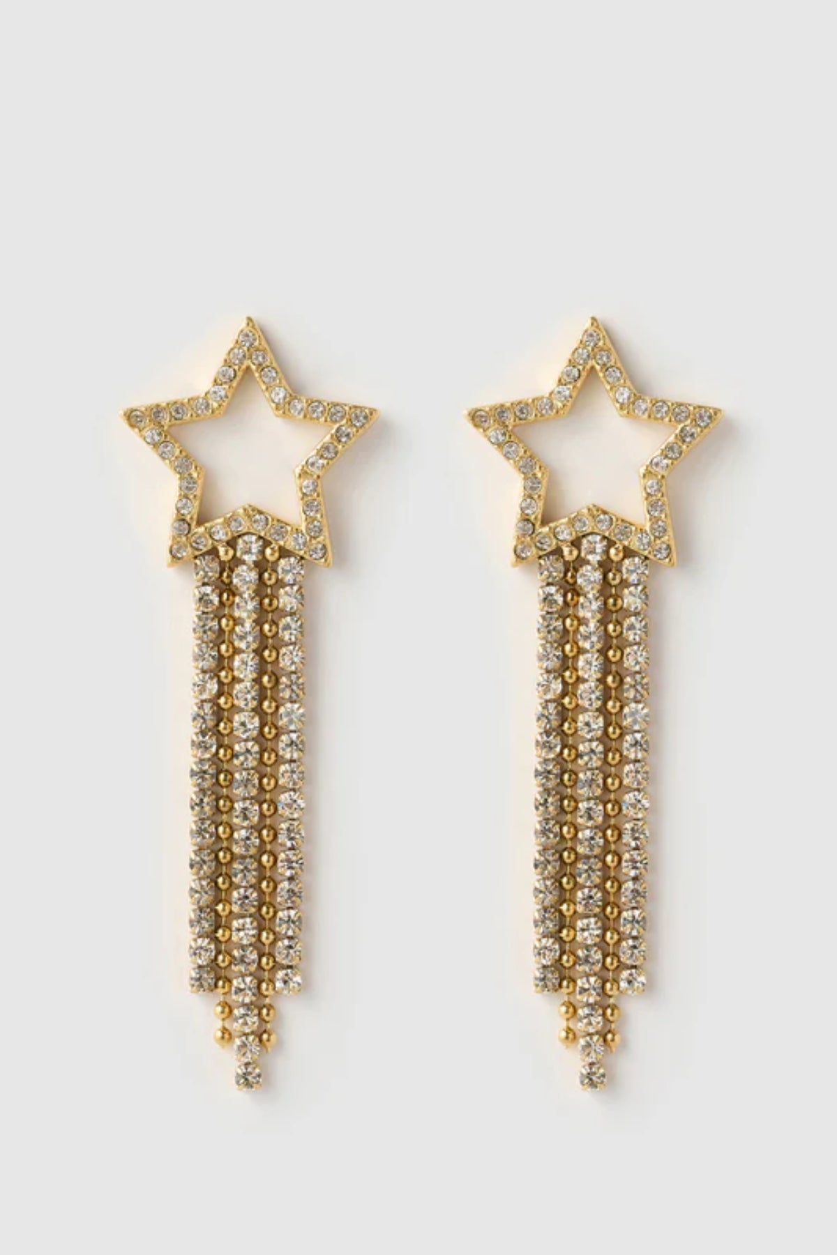 Starburst Gold Earrings by Arms of Eve, bold star-shaped drops with sparkling zircon stones and tassel chains that radiate elegance and edge.