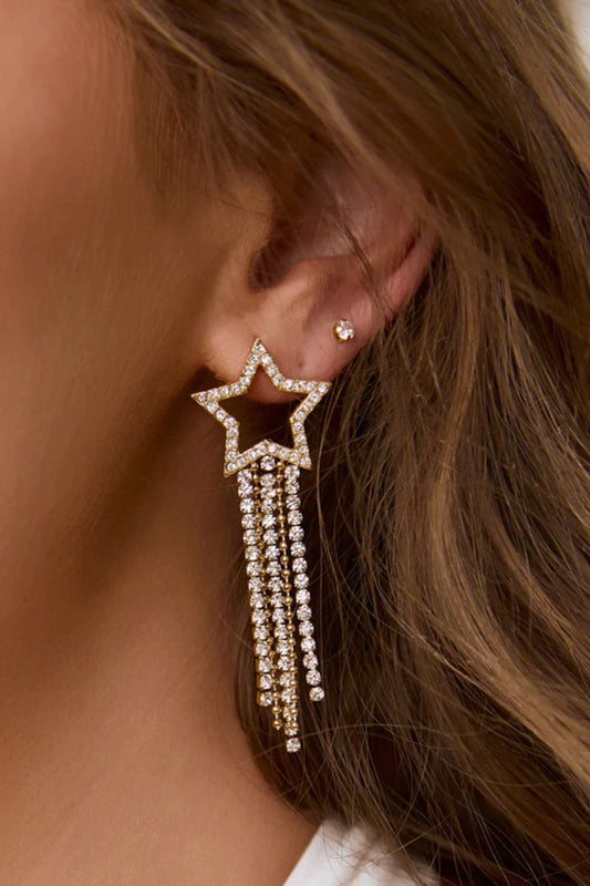 Starburst Gold Earrings by Arms of Eve, bold star-shaped drops with sparkling zircon stones and tassel chains that radiate elegance and edge