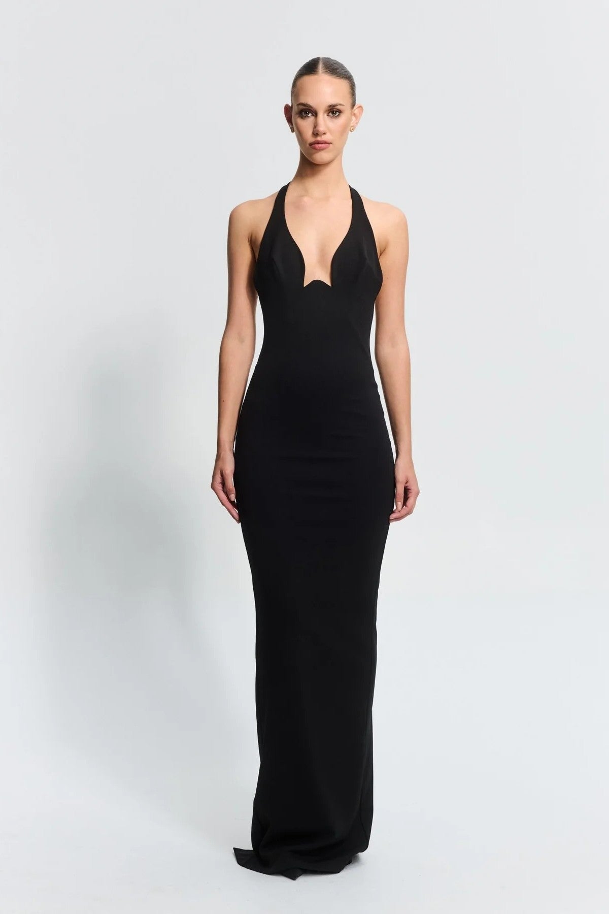 Starla Gown in Black by Effie Kats – sculpted neckline and low back design in stretch crepe. A timeless choice for elegant events.