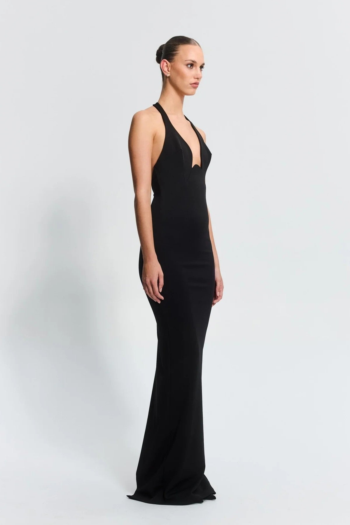 Starla Gown in Black by Effie Kats – sculpted neckline and low back design in stretch crepe. A timeless choice for elegant events.