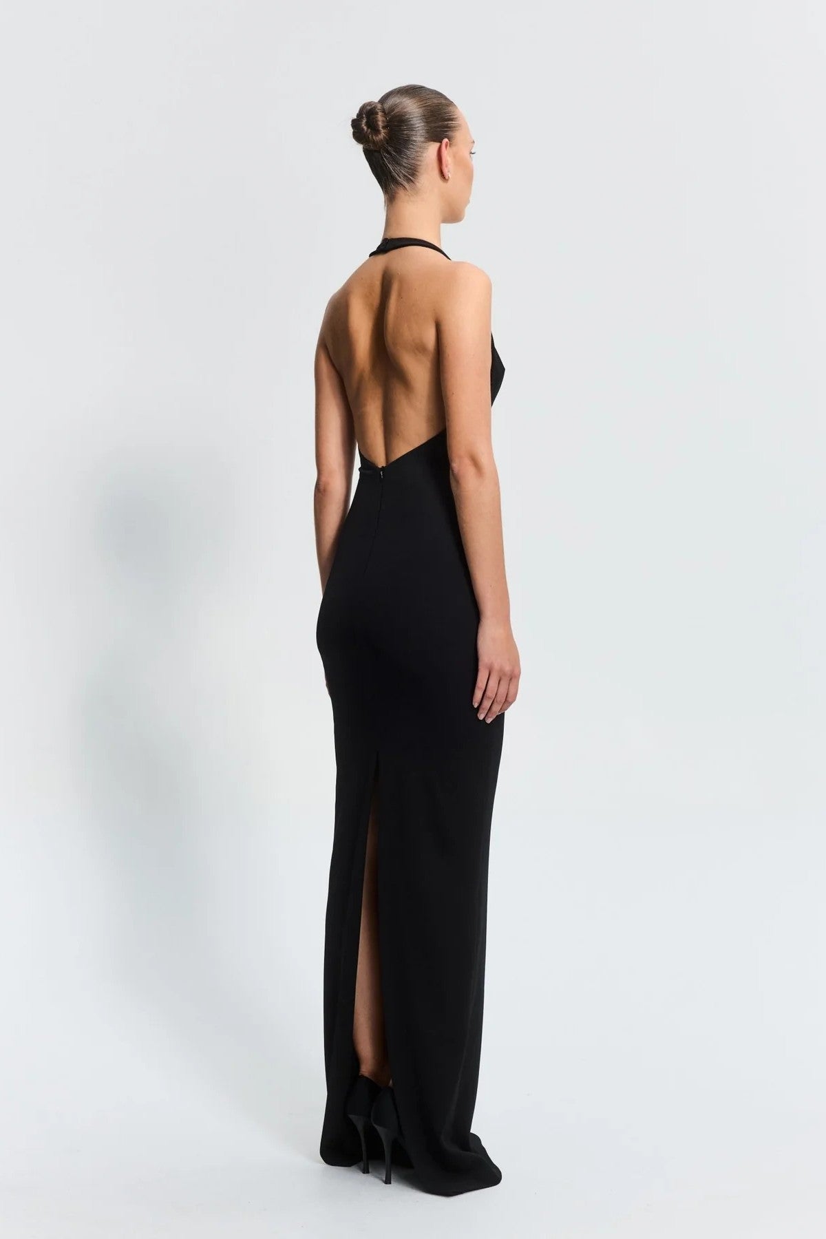 Starla Gown in Black by Effie Kats – sculpted neckline and low back design in stretch crepe. A timeless choice for elegant events.