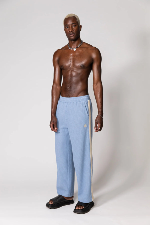 Steel Blue Knitted Baggy Pants by Something Very Special, featuring stripe jacquard and tonal embroidery. Unisex comfort redefined.