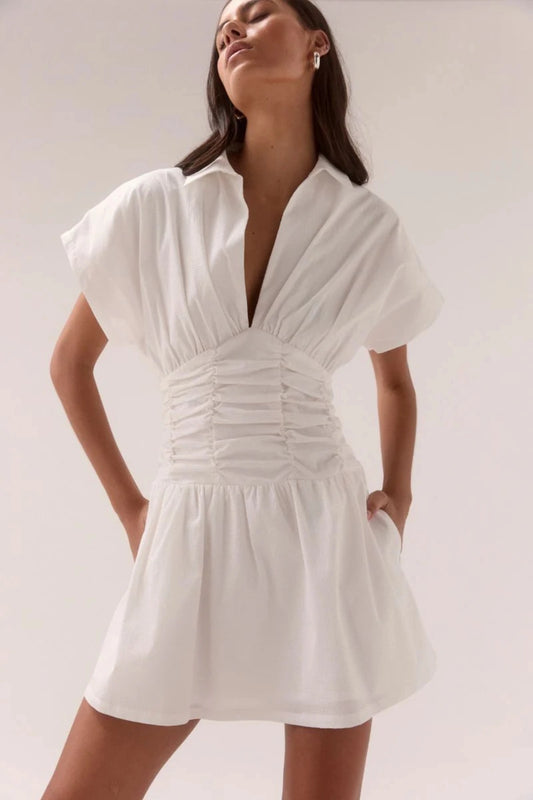 Stellar Mini Dress Chalk by Sovere, cotton blend mini with ruched waist, voluminous skirt and V-neckline, a trendy piece perfect for events or chic days.