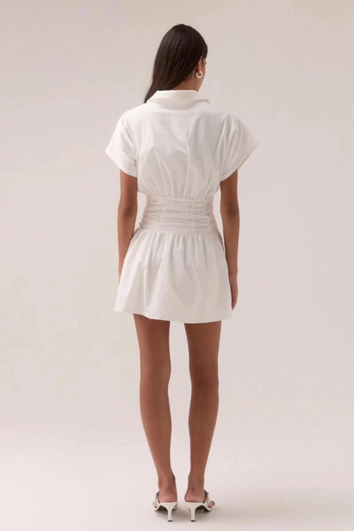 Stellar Mini Dress Chalk by Sovere, cotton blend mini with ruched waist, voluminous skirt and V-neckline, a trendy piece perfect for events or chic days.