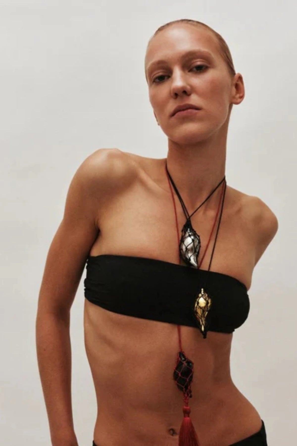 Sterling Necklace in Black/Gold by Heaven Mayhem – a black and gold knotted cord necklace with a sculptural shell pendant, perfect for bold modern styling.