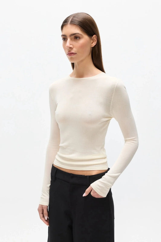 Stevie Top Ivory by Bayse – semi sheer long sleeve top with crew neckline and body-skimming fit.