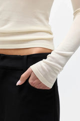 Stevie Top Ivory by Bayse – semi sheer long sleeve top with crew neckline and body-skimming fit.