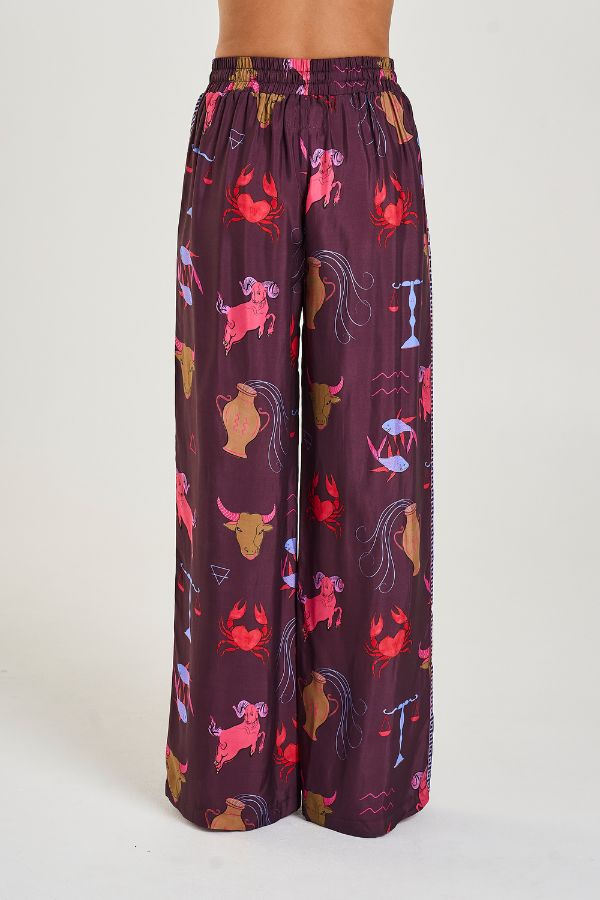 Wide Leg Pants in Zodiac Zod by Summi Summi, relaxed wide-leg pants with Zodiac print and SS trim, perfect for pairing with the matching oversized shirt or a simple top for an elevated lounge-to-street look.