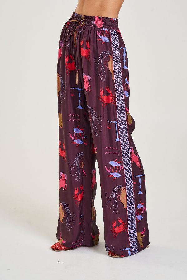 Wide Leg Pants in Zodiac Zod by Summi Summi, relaxed wide-leg pants with Zodiac print and SS trim, perfect for pairing with the matching oversized shirt or a simple top for an elevated lounge-to-street look.