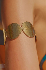 Sunset Hour Arm Cuff Gold by Emma Pills - hammered gold cuff bracelet with molten design, designed for a bold sculptural statement.