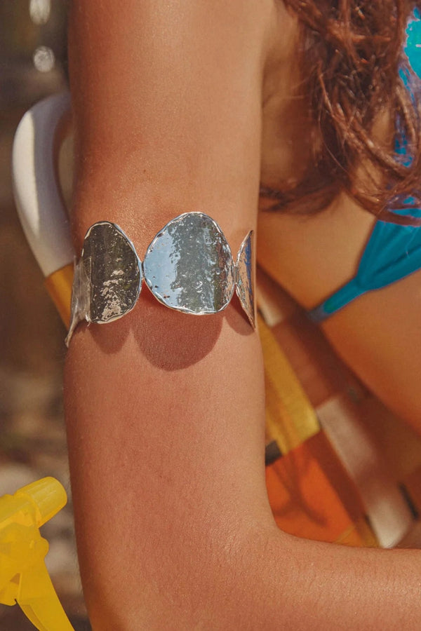 Sunset Hour Arm Cuff Silver by Emma Pills - hammered silver cuff bracelet with molten design, designed for a bold sculptural statement.