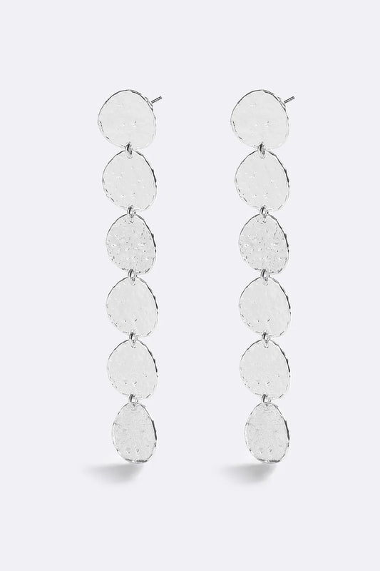 Sunset Hour Earrings Silver by Emma Pills - long silver drop earrings with hammered texture, designed for a bold statement look.