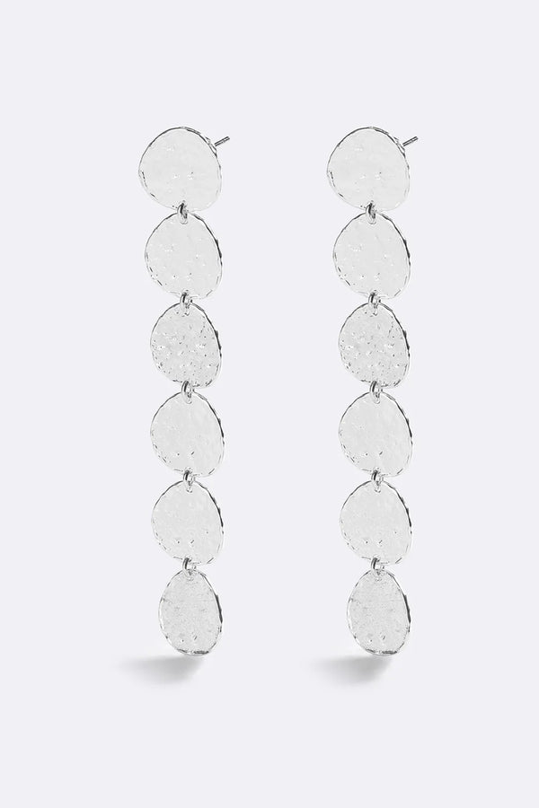 Sunset Hour Earrings Silver by Emma Pills - long silver drop earrings with hammered texture, designed for a bold statement look.