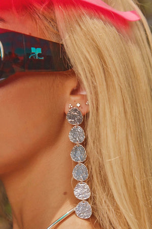 Sunset Hour Earrings Silver by Emma Pills - long silver drop earrings with hammered texture, designed for a bold statement look.