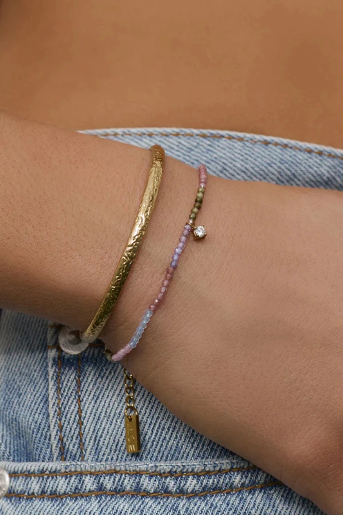 Taylor Bracelet by Arms of Eve, vibrant gold bracelet with colourful zircon stones and charm detail for effortless day-to-night sparkle.