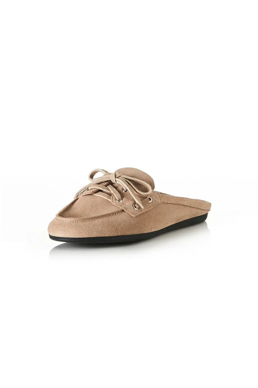 Tessa in Natural Suede by Alias Mae, a backless boat shoe in premium suede with flat heel and soft leather lining, ideal for effortless, relaxed styling.
