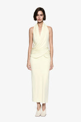 The Cabana Cupro Dress by MISHA, a lemon midi with halter neckline and soft hip drape. Perfect for weddings or refined summer events.