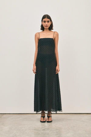 The Camilla Dress Beaded Noir by Solaqua – sheer beaded maxi dress with geometric embellishments and elegant drape.