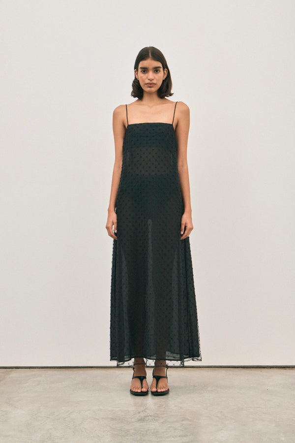 The Camilla Dress Beaded Noir by Solaqua – sheer beaded maxi dress with geometric embellishments and elegant drape.