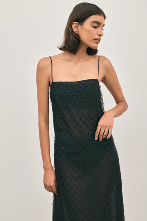 The Camilla Dress Beaded Noir by Solaqua – sheer beaded maxi dress with geometric embellishments and elegant drape.