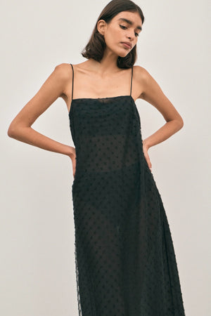The Camilla Dress Beaded Noir by Solaqua – sheer beaded maxi dress with geometric embellishments and elegant drape.