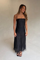 The Camilla Dress Beaded Noir by Solaqua – sheer beaded maxi dress with geometric embellishments and elegant drape.