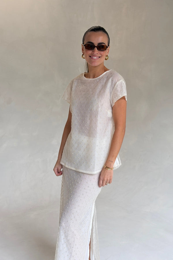 The Chelsea Beaded Top Ivory by Solaqua – sheer beaded top with geometric embellishments and detachable camisole.