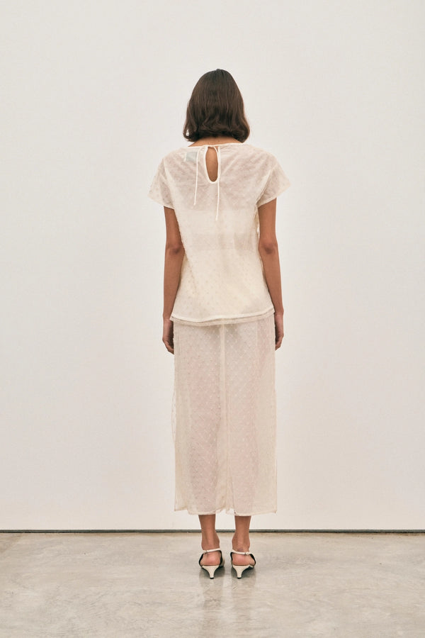 The Chelsea Beaded Top Ivory by Solaqua – sheer beaded top with geometric embellishments and detachable camisole.