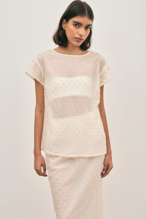 The Chelsea Beaded Top Ivory by Solaqua – sheer beaded top with geometric embellishments and detachable camisole.