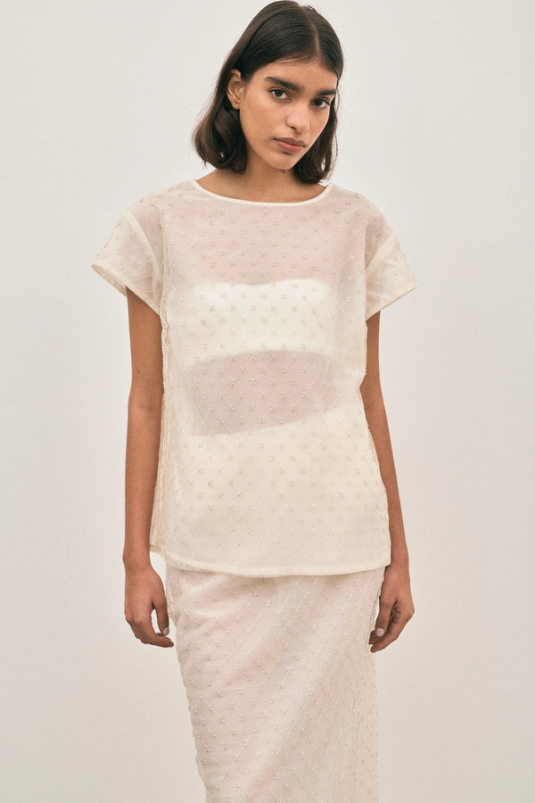 The Chelsea Beaded Top Ivory by Solaqua – sheer beaded top with geometric embellishments and detachable camisole.