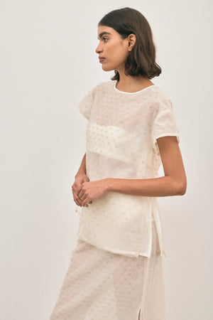 The Chelsea Beaded Top Ivory by Solaqua – sheer beaded top with geometric embellishments and detachable camisole.