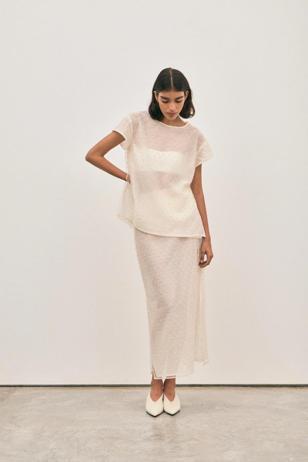 The Chelsea Beaded Top Ivory by Solaqua – sheer beaded top with geometric embellishments and detachable camisole.