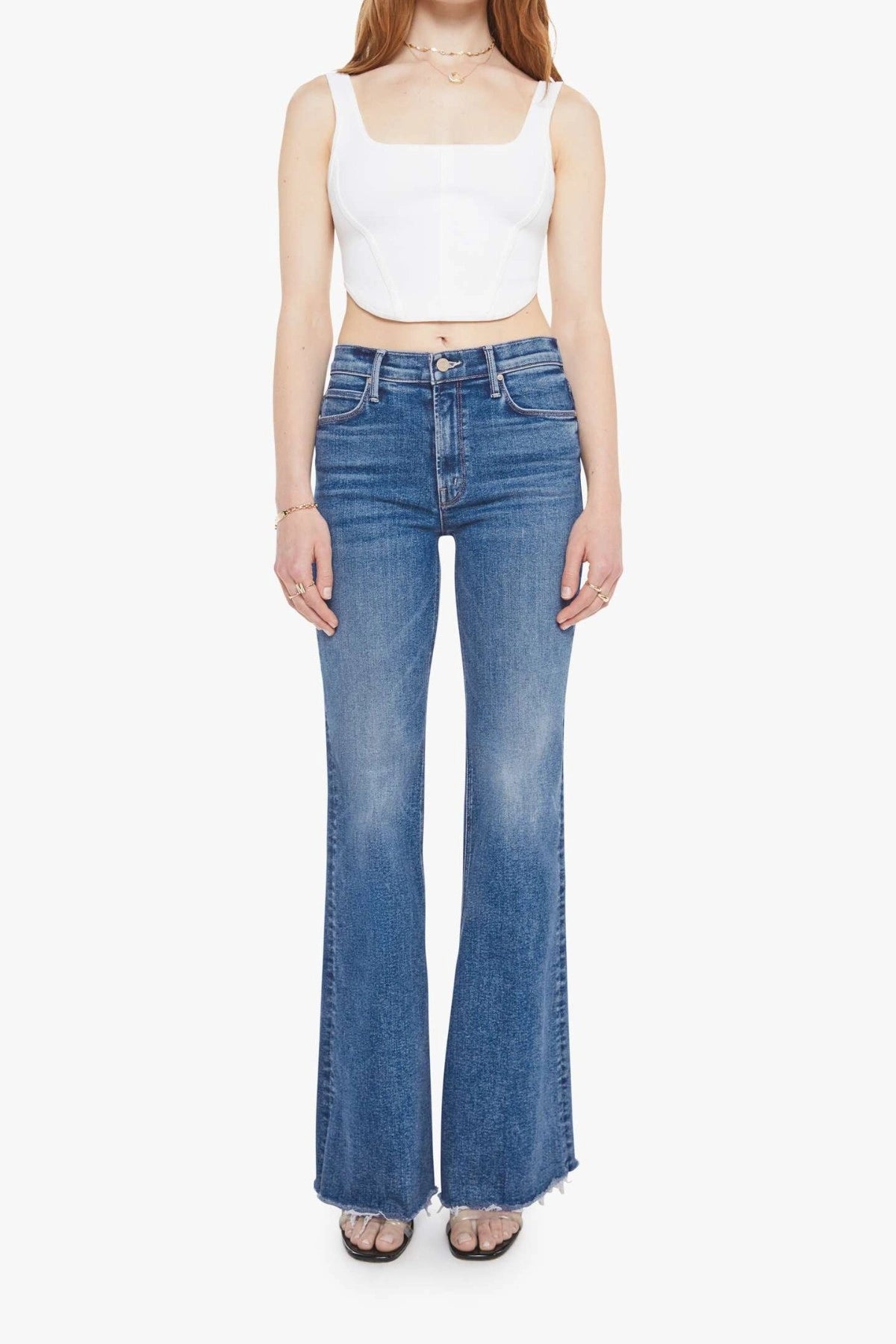 The Doozy Sneaky Fray Let’s Split by MOTHER, high-rise flared jeans with frayed hems and soft fading for an effortless vintage look.