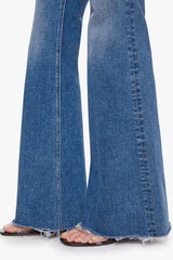 The Doozy Sneaky Fray Let’s Split by MOTHER, high-rise flared jeans with frayed hems and soft fading for an effortless vintage look.