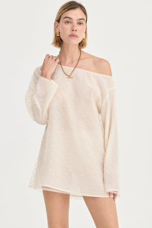 The Eloise Beaded Mini Ivory by Solaqua – sheer beaded mini dress with off shoulder neckline and oversized fit.