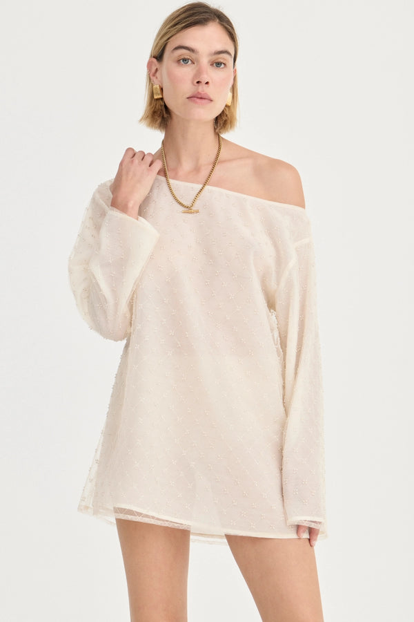 The Eloise Beaded Mini Ivory by Solaqua – sheer beaded mini dress with off shoulder neckline and oversized fit.